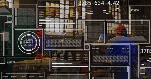 Carpenters operating table saw in busy workshop
