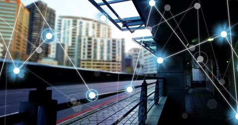 Glowing digital network overlaying modern urban walkway and glass architecture