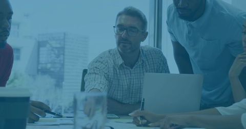 Diverse Team Engaged in Strategy Meeting with Leader Presenting