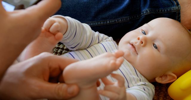 Adorable Infant Lying On Back Holding Feet - Download Free Stock Images Pikwizard.com