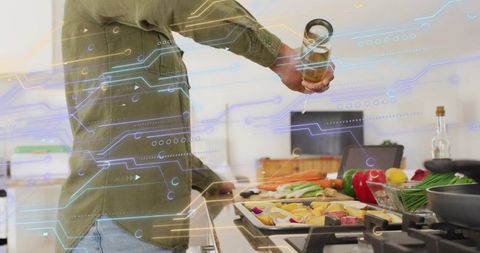 Pouring oil in smart kitchen with ar overlay for home cooking vegetable meal prep