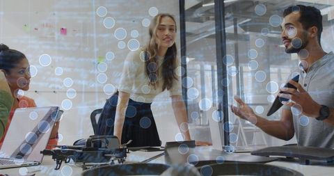 Team Brainstorming with Drone and Tech in Innovative Office