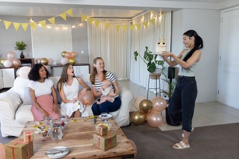 Diverse Women Enjoy Baby Shower with Cake and Decorations