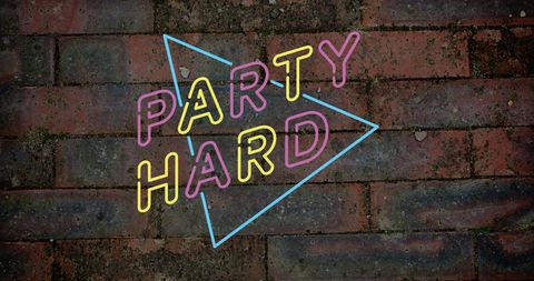 Colorful Party Hard Text on Vintage Brick Wall Background