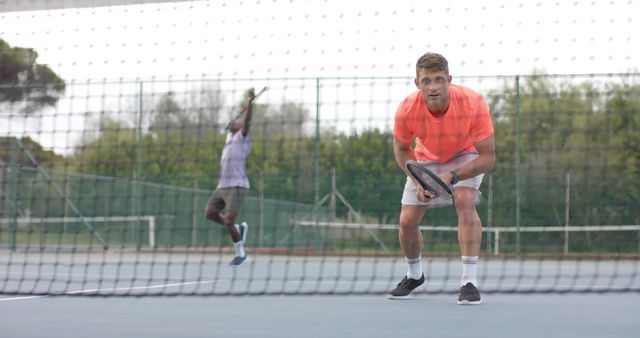 Tennis Players Focusing on Court During Intense Match - Download Free Stock Images Pikwizard.com