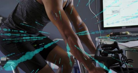 Male athlete pedaling on smart ergometer with teal data overlays and performance charts