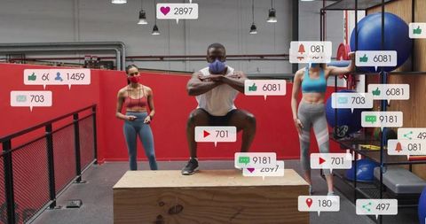 Masked athletes performing box squat during studio training with social media overlays