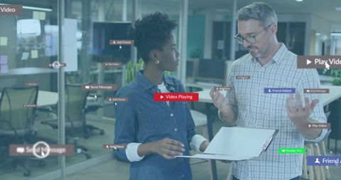 Diverse Business Team Analyzing Digitally Enhanced Social Media Layouts