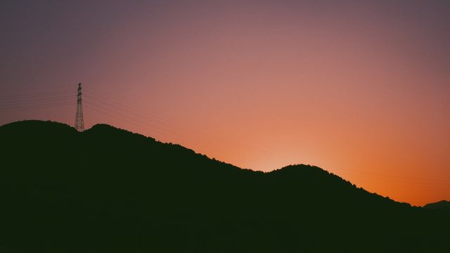 Silhouette of Mountains and Tower at Sunset - Download Free Stock Photos Pikwizard.com