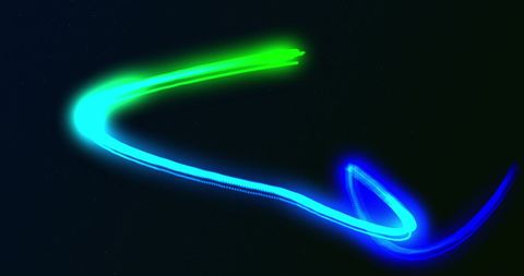 Glowing blue-green neon light trail on dark background