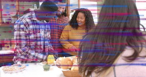 Group of friends preparing cozy weekend brunch at kitchen island sharing conversation and laughter