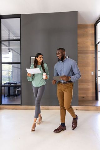Dynamic business professionals engaged in collaborative office walk