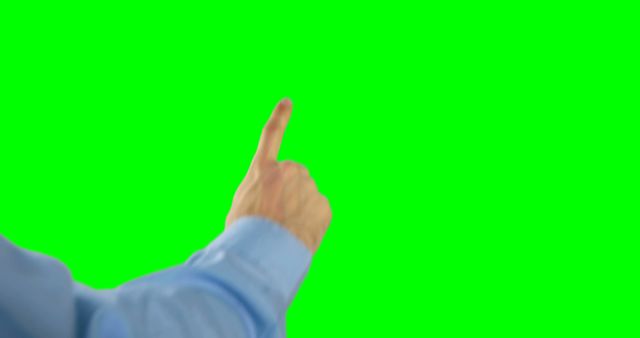 Hand in a business attire making a pointing gesture against a green screen background. Suitable for use in business presentations, instructional videos, technology demonstrations, and interactive touch interfaces.