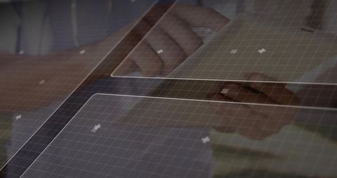 Interacting with transparent touchscreen interface over tablet display with grid overlay