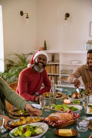 Festive Dinner Gathering with Friends Laughing and Enjoying Meal