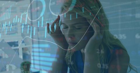 Stressed businesswoman surrounded by financial data visualizations