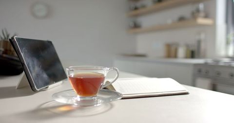 Peaceful Morning Tea with Tablet and Notebook on Kitchen Counter - Download Free Stock Images Pikwizard.com