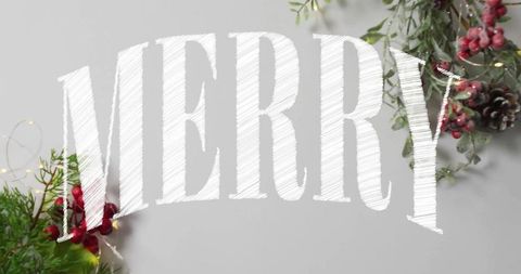 Merry sketch lettering arching over tabletop with evergreen foliage and fairy lights