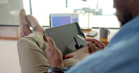 Remote work setup with digital tablet and stylus for creative projects