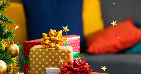 Bright Holiday Gifts with Floating Golden Stars on Christmas - Download Free Stock Images Pikwizard.com