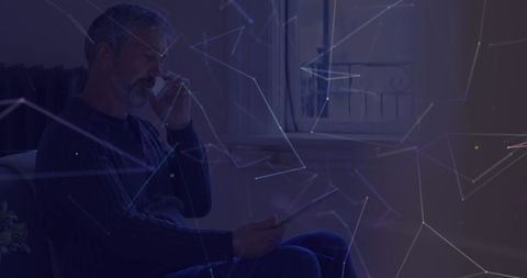 Elderly Man Engages in Technology Amidst Digital Network Overlay