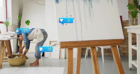 Artist engaged in creative work in inspiring art studio