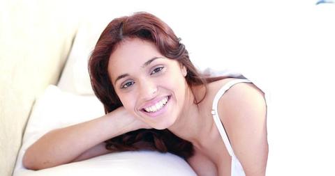 Woman Smiling in Bed Under White Blanket - Download Free Stock Images Pikwizard.com