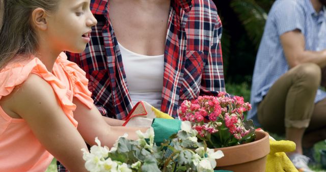 Mother and Daughter Planting Flowers Together in Garden - Download Free Stock Images Pikwizard.com