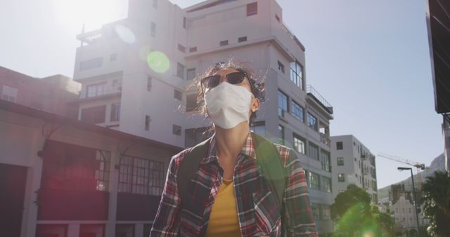 Young Woman Wearing Face Mask in the City Under Bright Sunlight - Download Free Stock Images Pikwizard.com