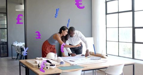 Architects Collaborating on Projects with Financial Symbols