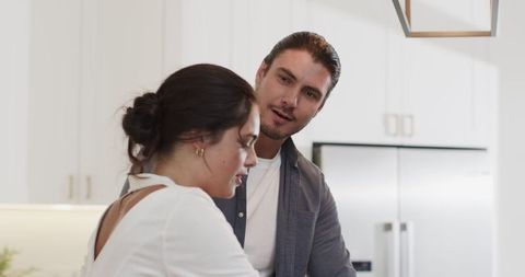 Couple Engaging in Happy Moment in Modern Kitchen
