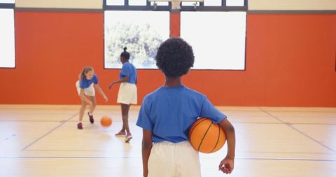 Girls Practicing Basketball in School Gym Basketball Team