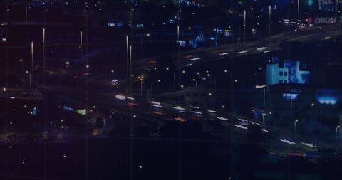 Cityscape at Night with Financial Data Overlay Concept