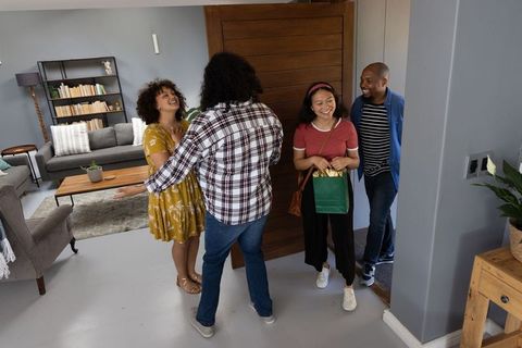 Welcoming Friends in Stylish Home Entryway Gathering