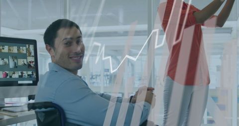 Inclusive Workplace with Smiling Man and Growth Graph Overlay - Download Free Stock Images Pikwizard.com