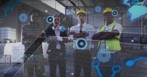 Industrial team studying hologram technology in warehouse