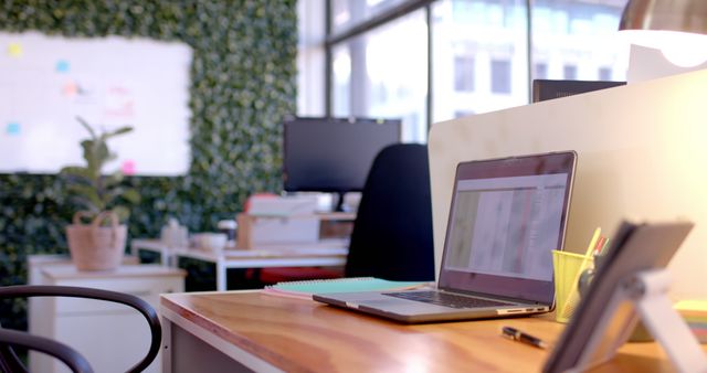 Close up of desk with computer and tablet in casual office. Casual business, interior, communication, technology and office.