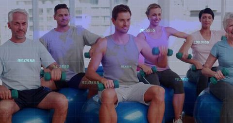 Group Exercise with Dumbbells and Stability Balls in Modern Gym