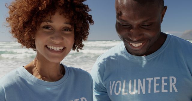 Smiling Volunteers Enjoying Beach Cleanup Activity - Download Free Stock Images Pikwizard.com