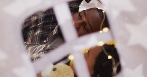 African american father and daughter enjoying cozy indoor playtime