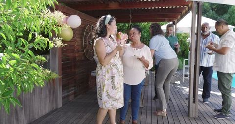 Diverse Women Celebrating Friendship in Relaxed Garden Setting