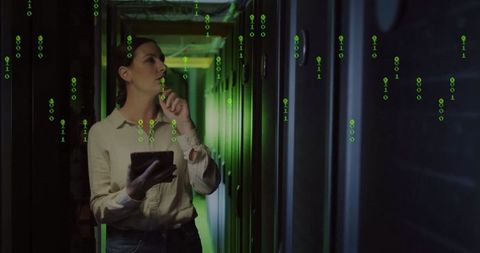 IT Engineer Analyzing Network with Binary Code Visuals