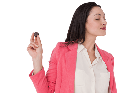 woman savoring chocolate in bright pink blazer on transparent background - Download Free Stock Videos Pikwizard.com
