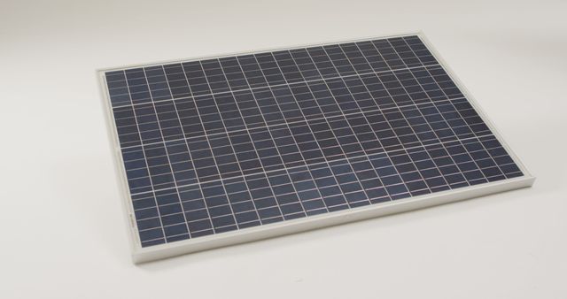 Photograph showing a clean solar panel on a white background. Suitable for illustrating concepts of renewable energy, sustainable resources, and modern technology. Ideal for use in articles, presentations, or advertisements promoting energy efficiency, green technology, and eco-friendly solutions.