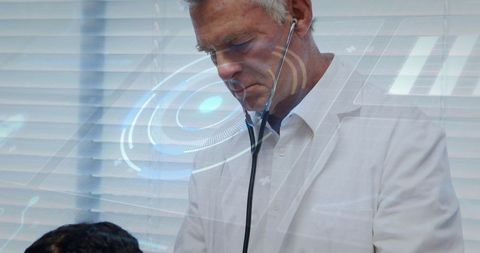 Senior doctor using stethoscope with futuristic hud overlay during child checkup