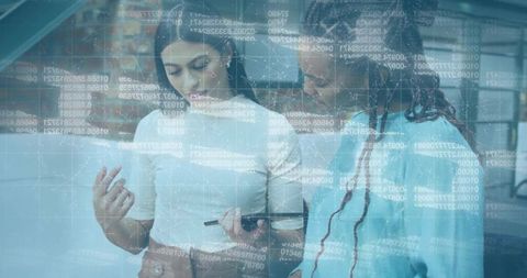 Coworkers analyzing digital code collaboration in modern office