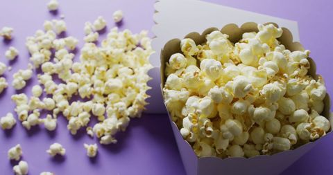 Popcorn in Cardboard Box on Purple Background - Download Free Stock Images Pikwizard.com