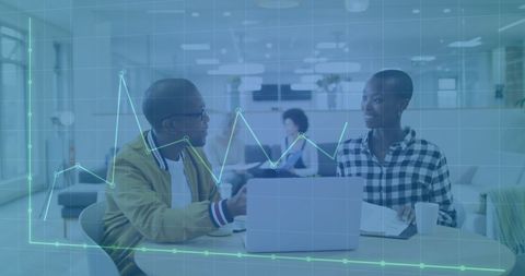 Financial analysis: colleagues communicating in modern office environment