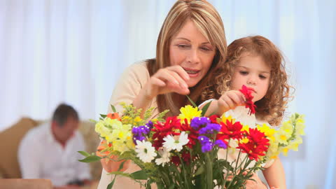 Grandmother and Granddaughter Arranging Colorful Bouquet Together