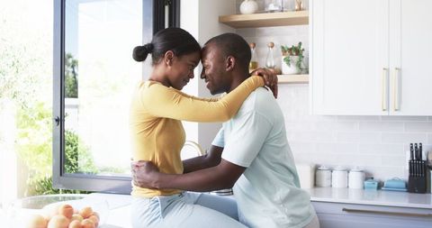 Loving Couple Embracing in Bright Modern Kitchen - Download Free Stock Images Pikwizard.com